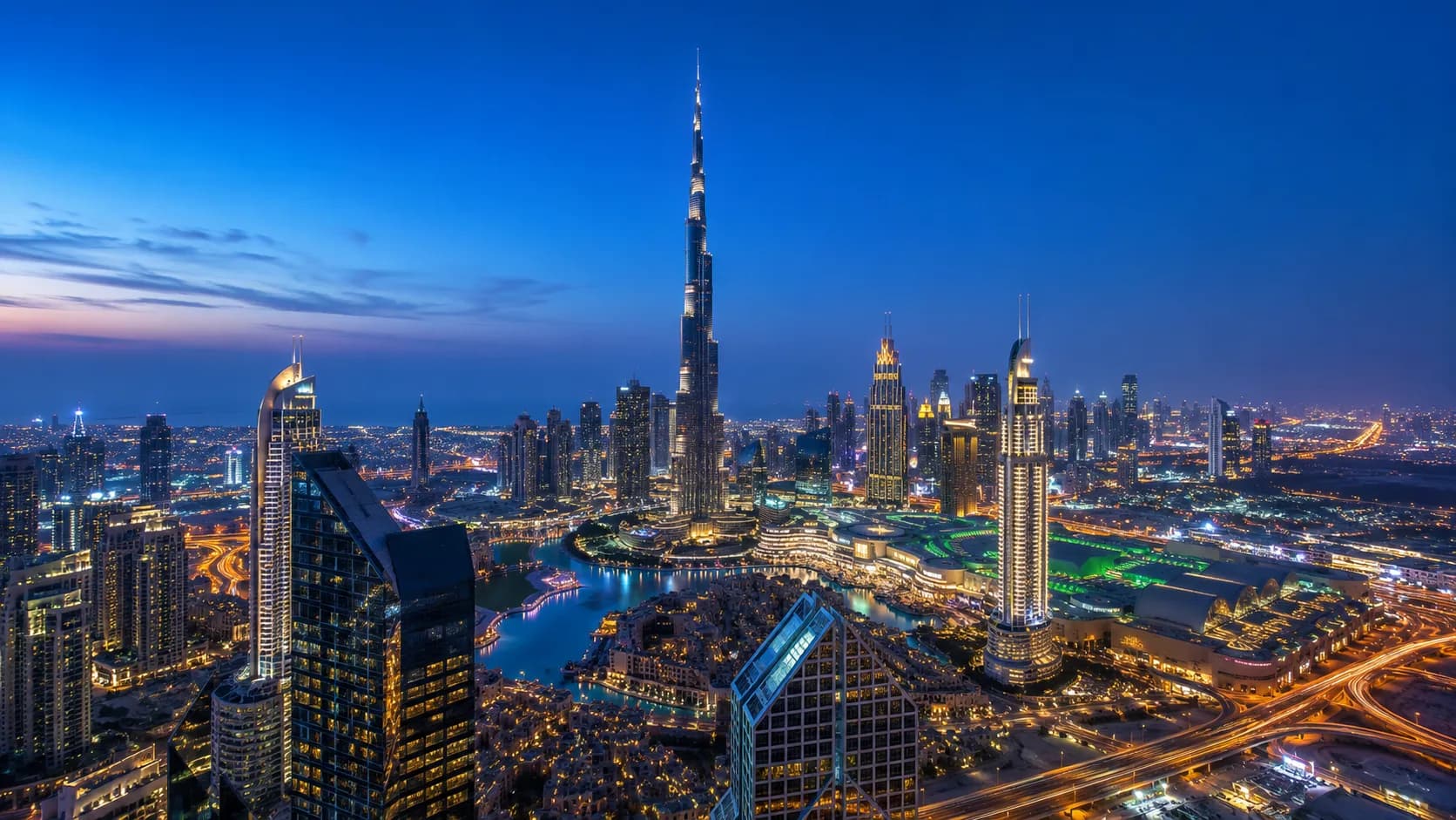 Dubai skyline at blue hour with the Burj Khalifa — ALTIS GULF PARTNERS is based in Dubai